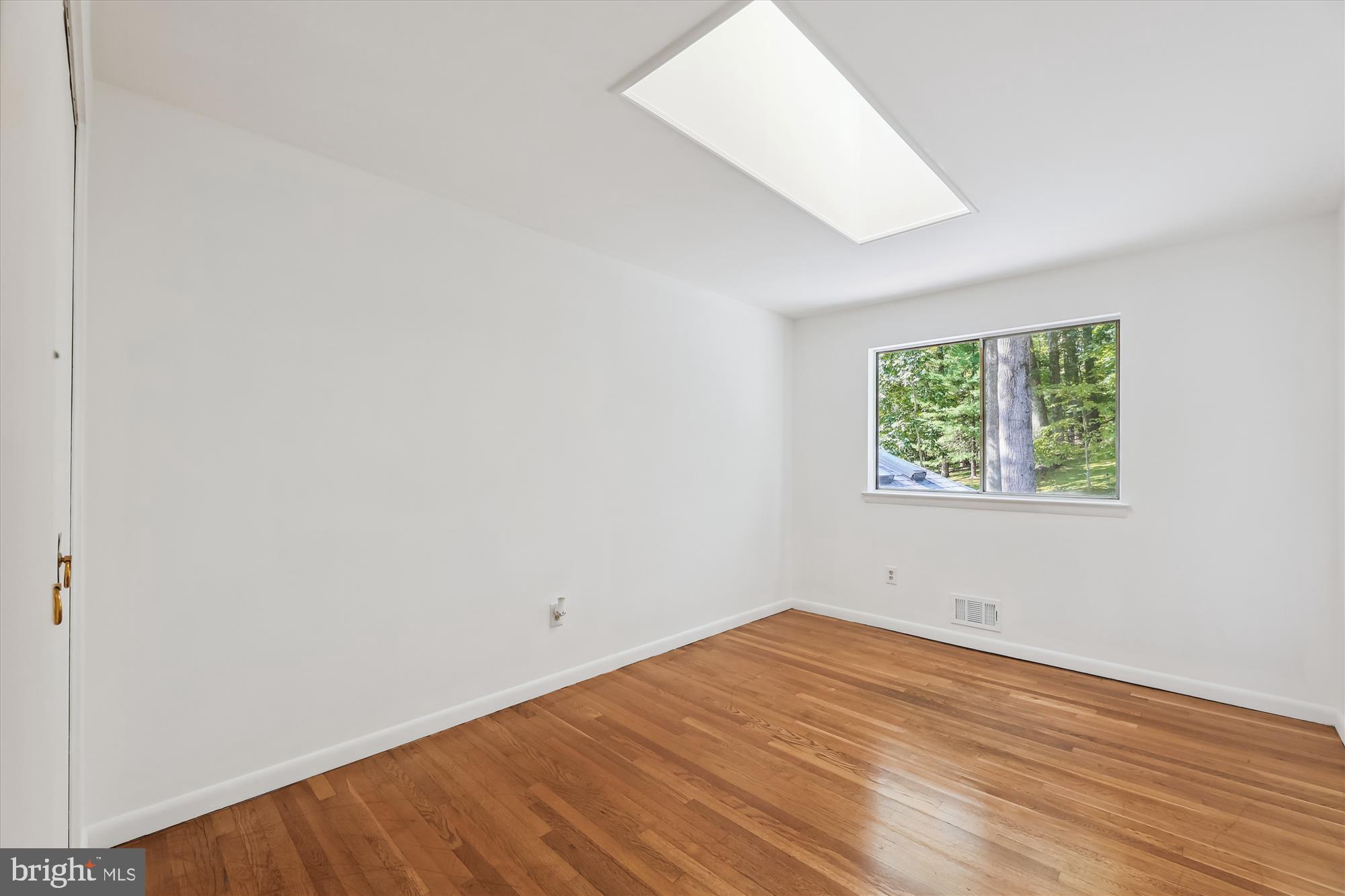 11616 Lovejoy Street Silver Spring, MD 20902 - Photo 30 of 72 Bedroom 1 wood floors, view of nature.