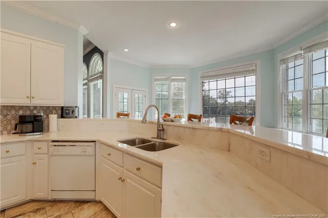 a kitchen with sink and cabinets