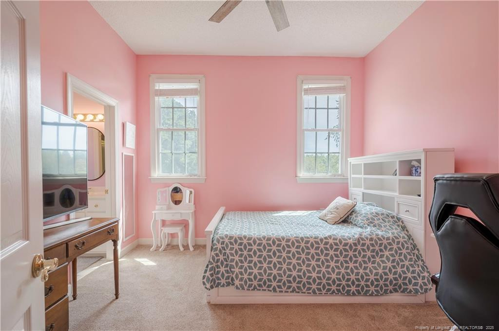 515 Briarwood Road Warsaw, NC 28398 - Photo 16 of 36 a bedroom with a bed and wooden floor