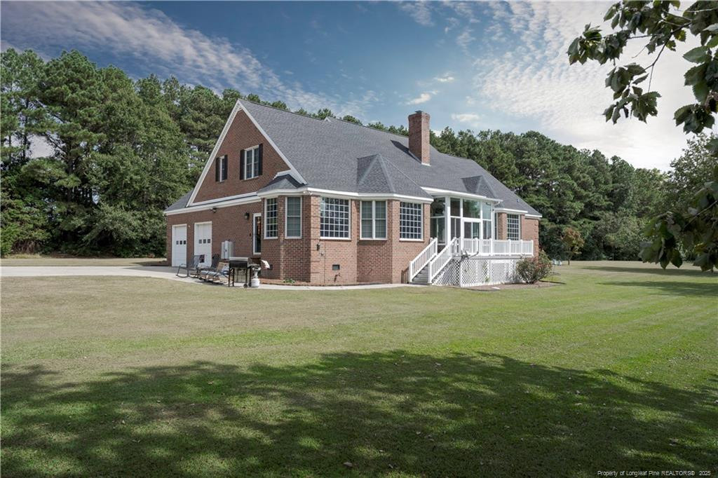 515 Briarwood Road Warsaw, NC 28398 - Photo 26 of 36 a front view of a house with a garden