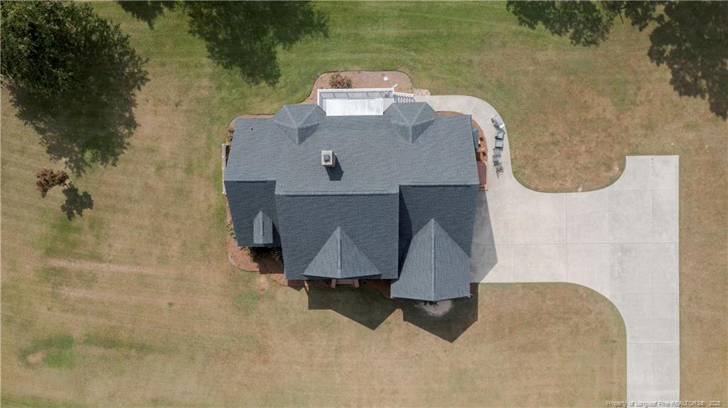 515 Briarwood Road Warsaw, NC 28398 - Photo 32 of 36 an aerial view of a house with a yard and lake view