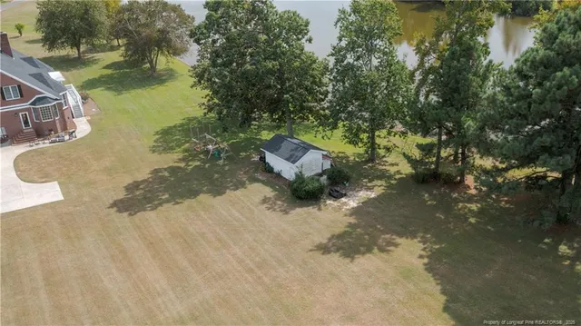 a view of a yard with swimming pool