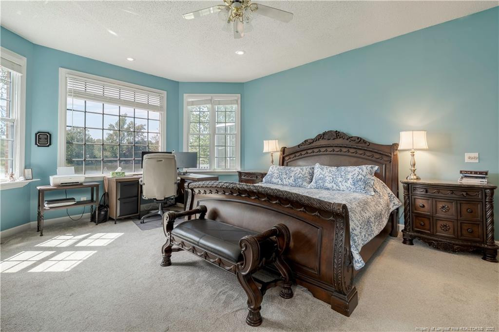 515 Briarwood Road Warsaw, NC 28398 - Photo 5 of 36 a bedroom with a bed and a table