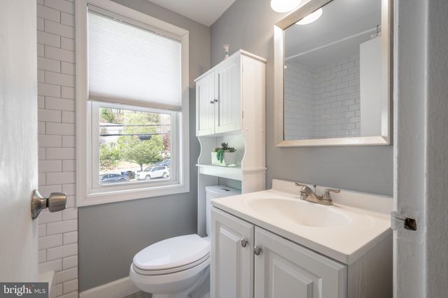 a bathroom with a sink toilet and vanity