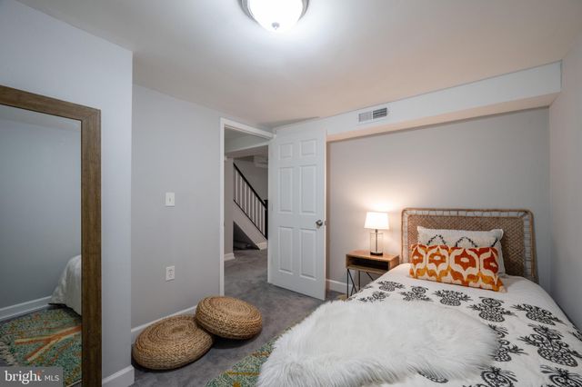 a bedroom with a bed and cabinets