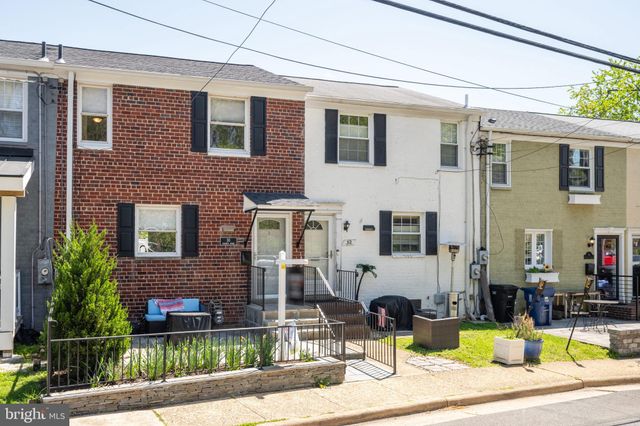 a view of a brick building with many windows