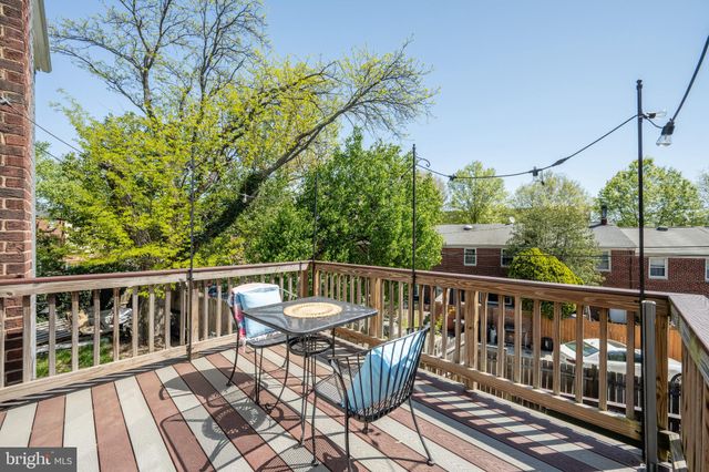 a view of a balcony with wooden floor