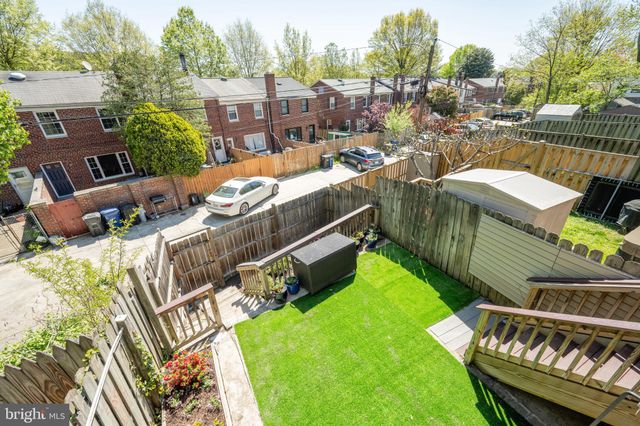 a view of a chairs and table in patio