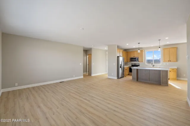 a view of kitchen with wooden floor