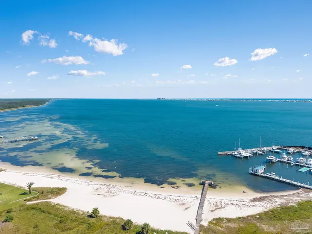 a view of a swimming pool with a table and chairs