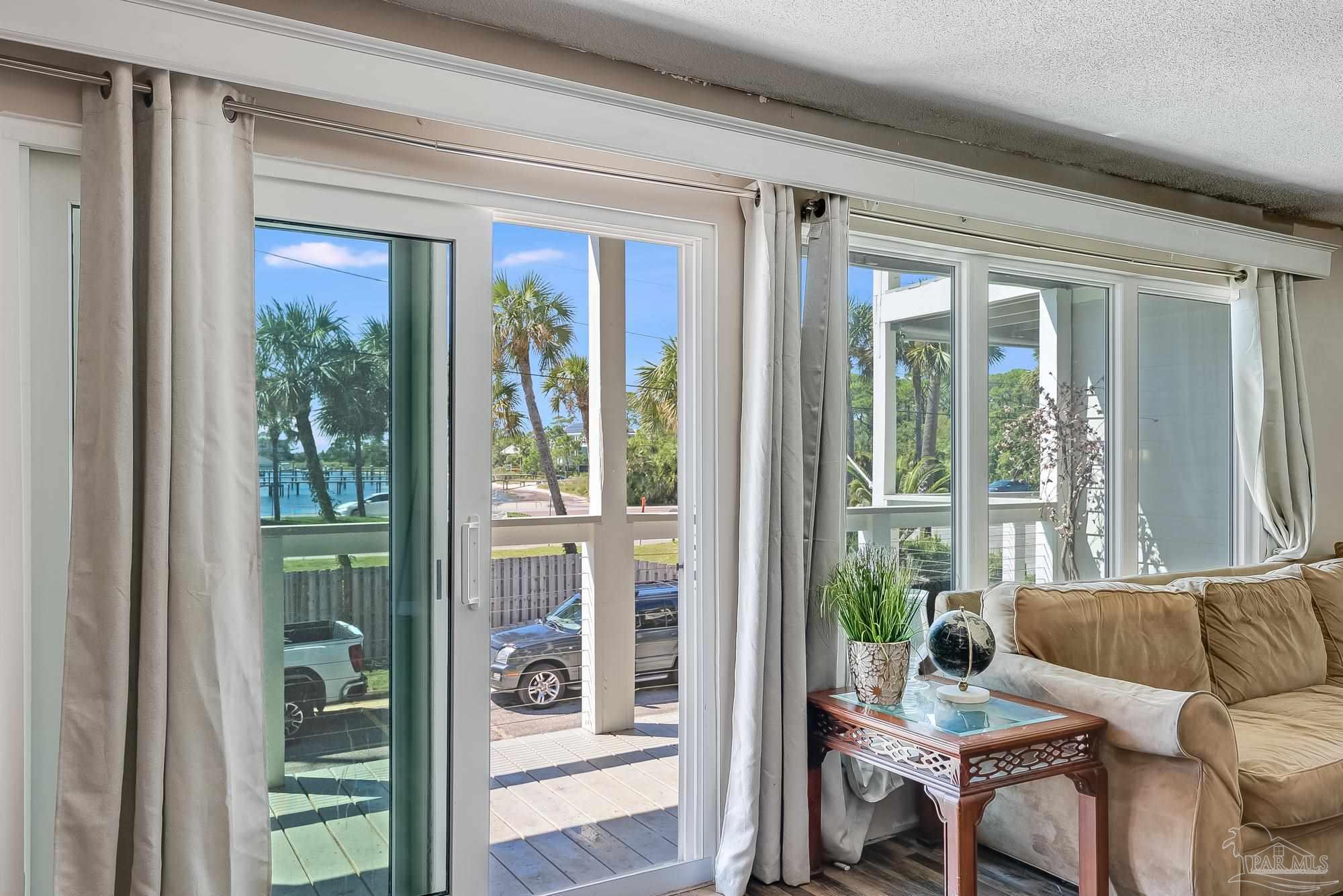 200 Pensacola Beach Road, Unit D2 Gulf Breeze, FL 32561 - Photo 6 of 40 a living room with furniture and a window