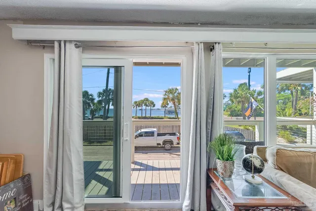 a room with a couch and a potted plant