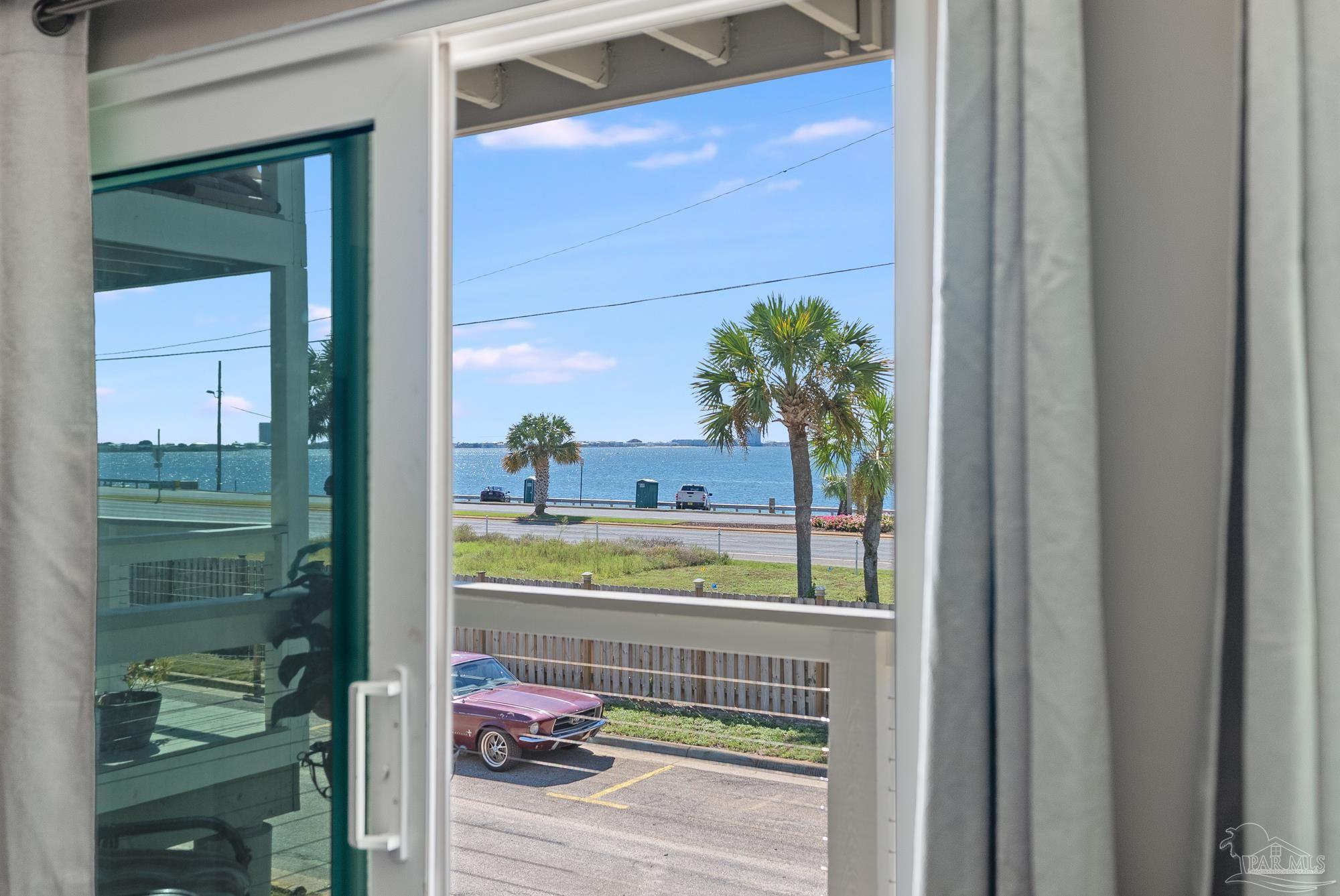 200 Pensacola Beach Road, Unit D2 Gulf Breeze, FL 32561 - Photo 10 of 40 a picture of a glass door and a window