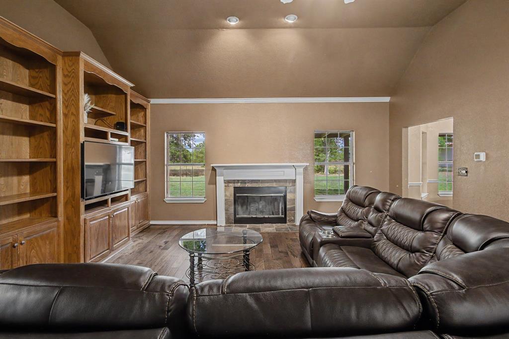 483 Christy Kay Lane Rhome, TX 76078 - Photo 9 of 40 a living room with furniture and a fireplace