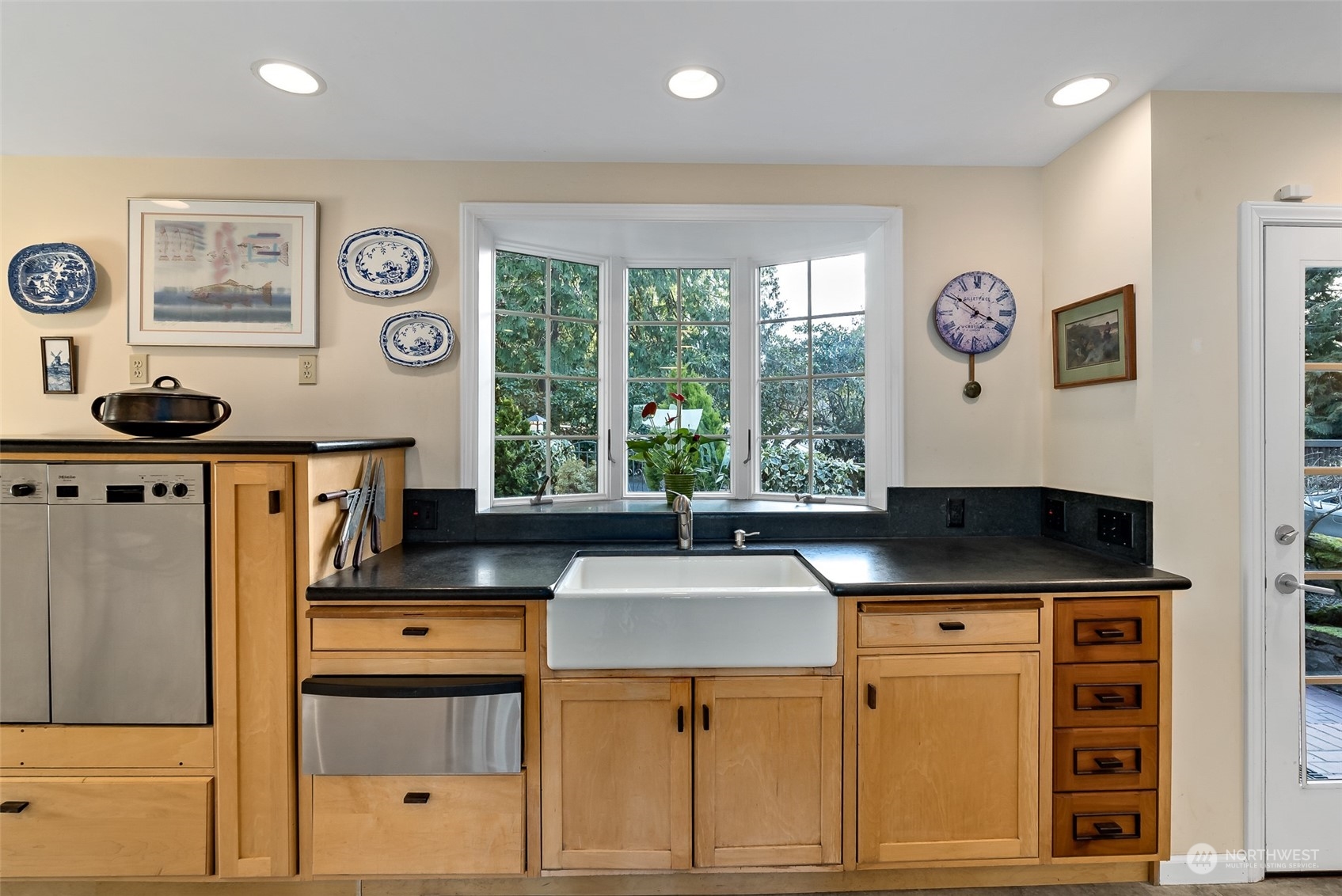 316 Chuckanut Point Road Bellingham, WA 98229 - Photo 18 of 40 a kitchen with stainless steel appliances a stove and cabinets