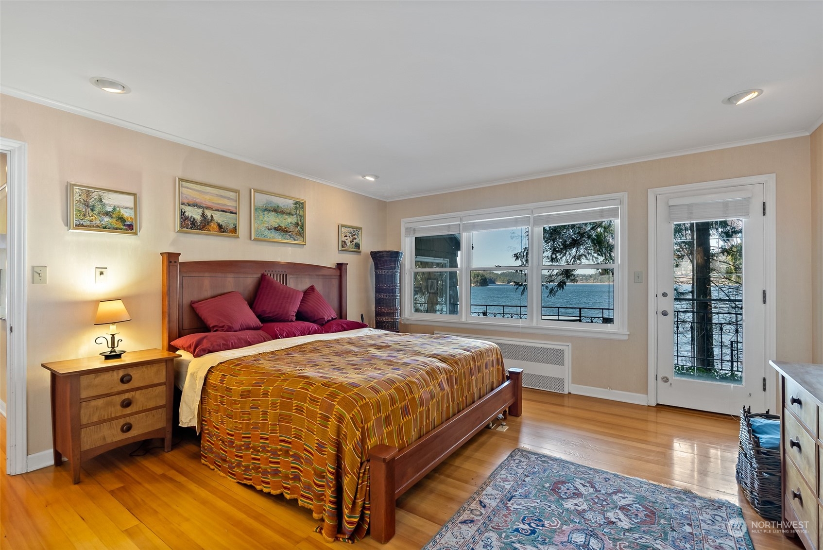 316 Chuckanut Point Road Bellingham, WA 98229 - Photo 22 of 40 a bedroom with a bed and wooden floor