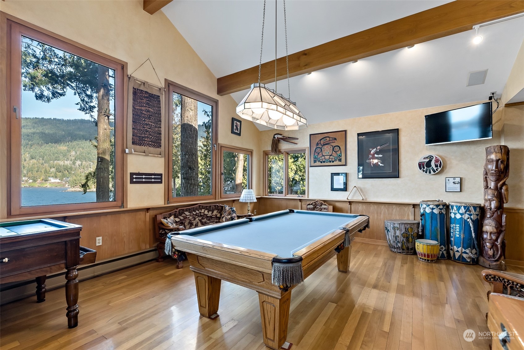 316 Chuckanut Point Road Bellingham, WA 98229 - Photo 27 of 40 a living room with a pool table and a large window
