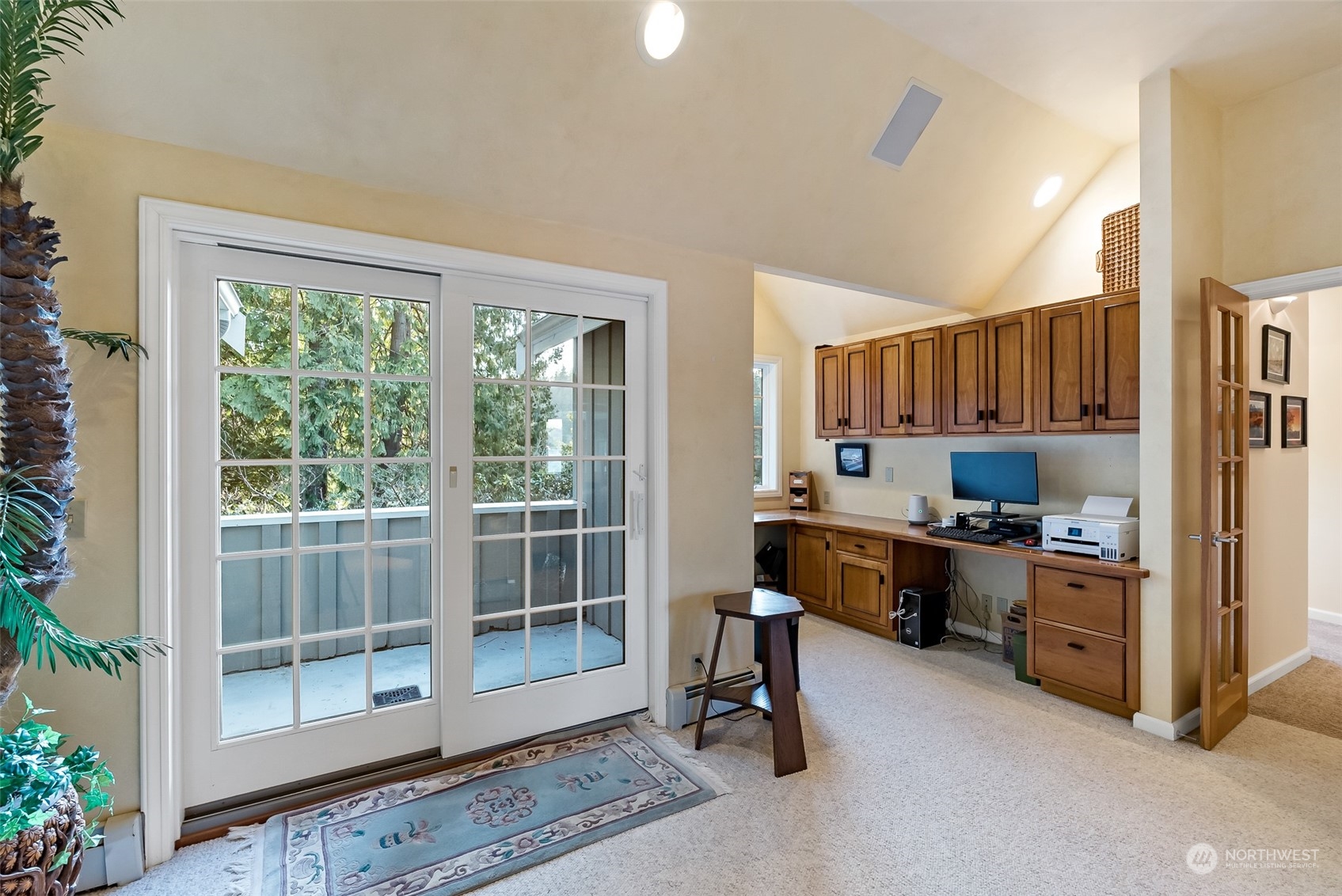 316 Chuckanut Point Road Bellingham, WA 98229 - Photo 29 of 40 a kitchen with stainless steel appliances granite countertop a stove top oven a sink dishwasher a dining table and chairs with wooden floor