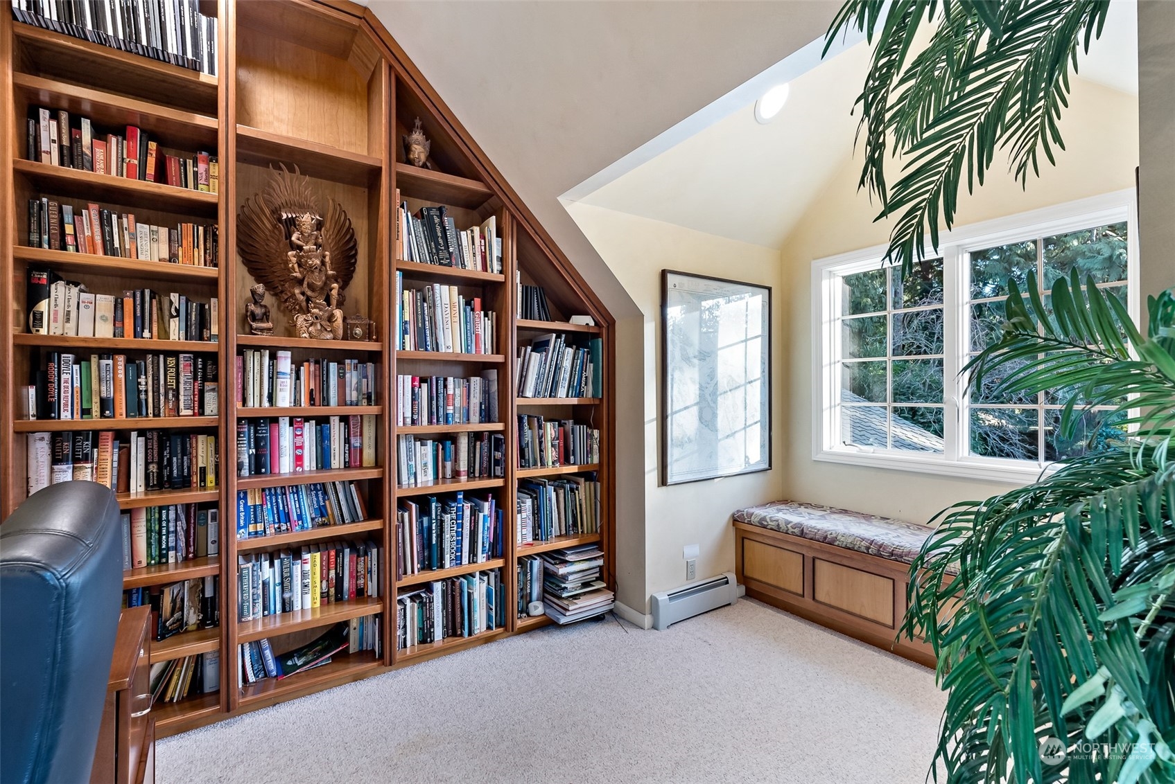 316 Chuckanut Point Road Bellingham, WA 98229 - Photo 30 of 40 a bedroom with a large book shelf and a book shelf