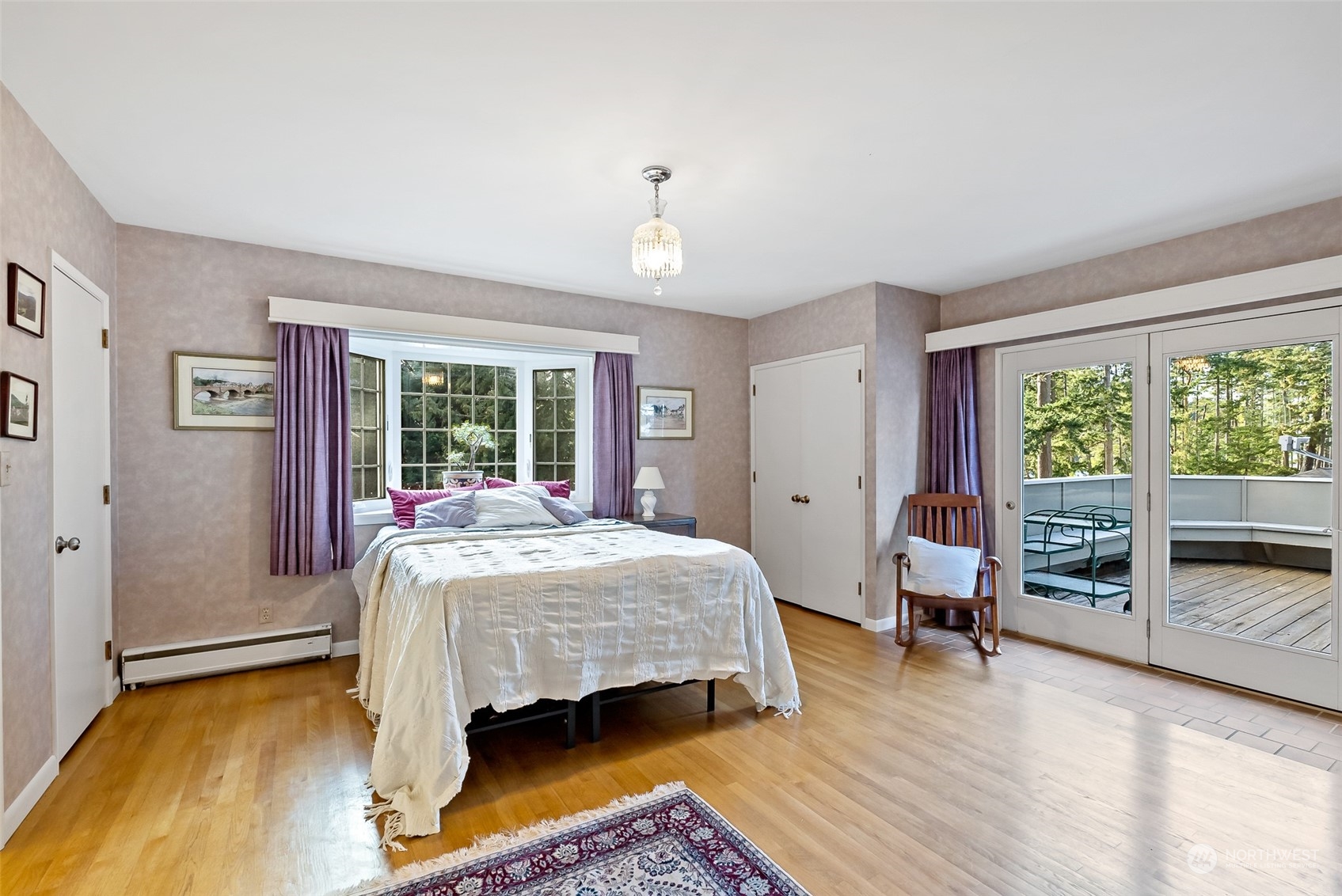 316 Chuckanut Point Road Bellingham, WA 98229 - Photo 33 of 40 a bedroom with a bed and wooden floor