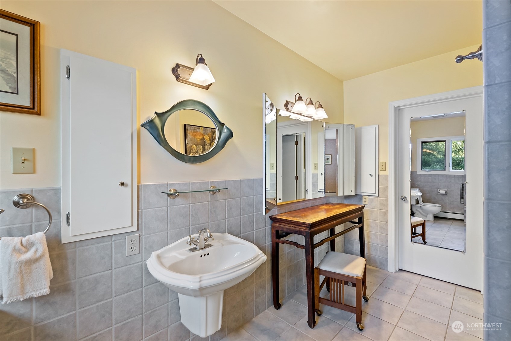 316 Chuckanut Point Road Bellingham, WA 98229 - Photo 36 of 40 a bathroom with a sink a mirror and a toilet