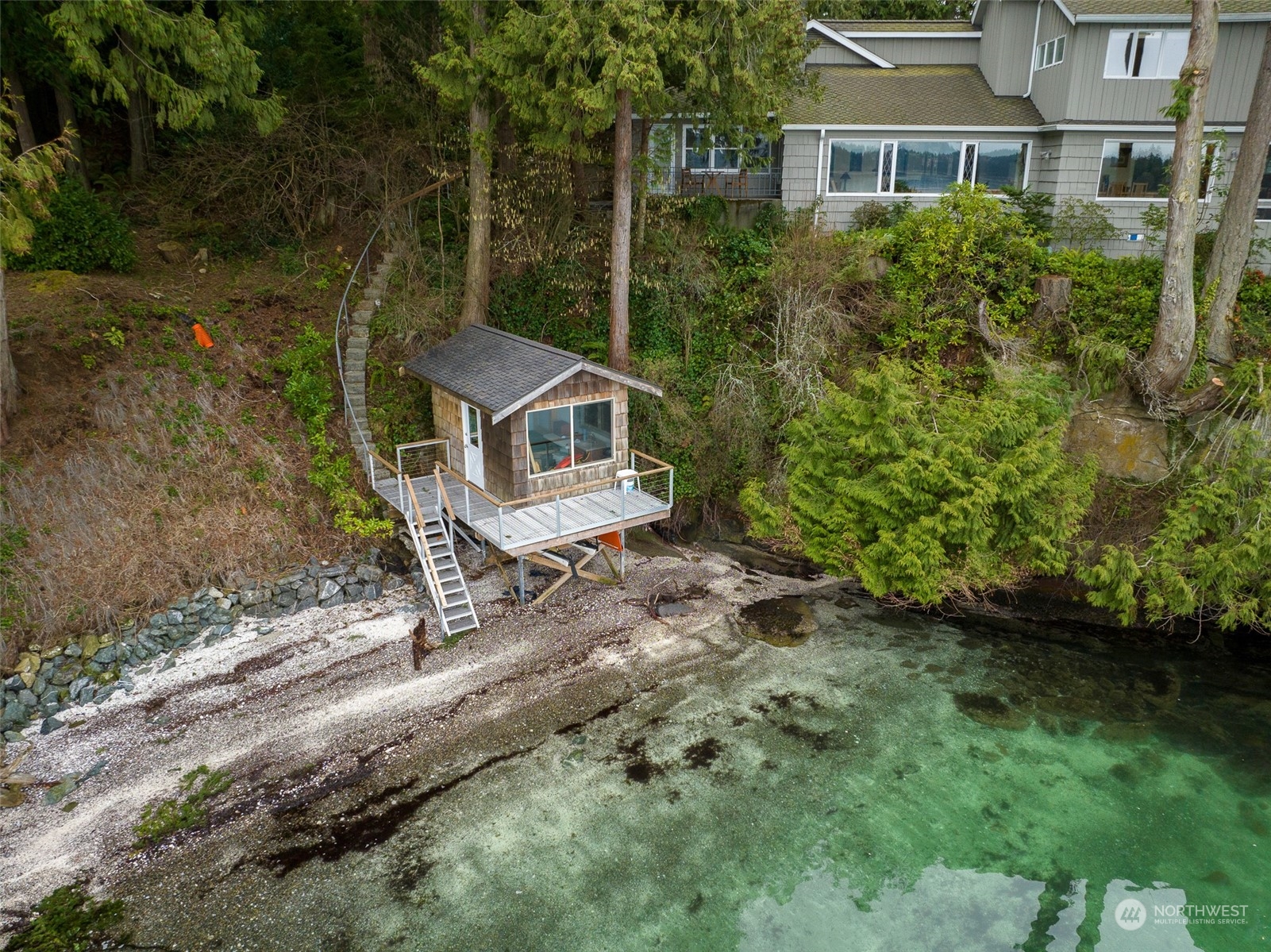 316 Chuckanut Point Road Bellingham, WA 98229 - Photo 37 of 40 an aerial view of a house with a yard and large trees
