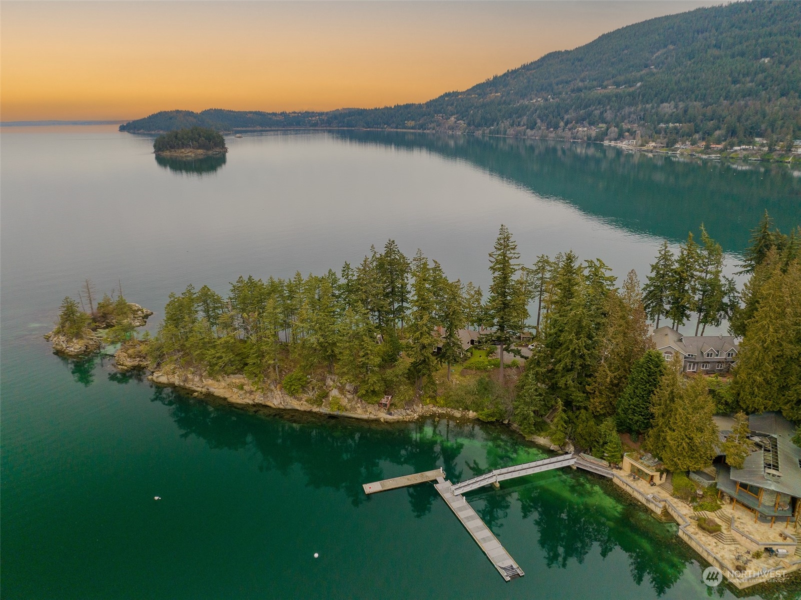 316 Chuckanut Point Road Bellingham, WA 98229 - Photo 40 of 40 a view of a lake with a yard and mountain view