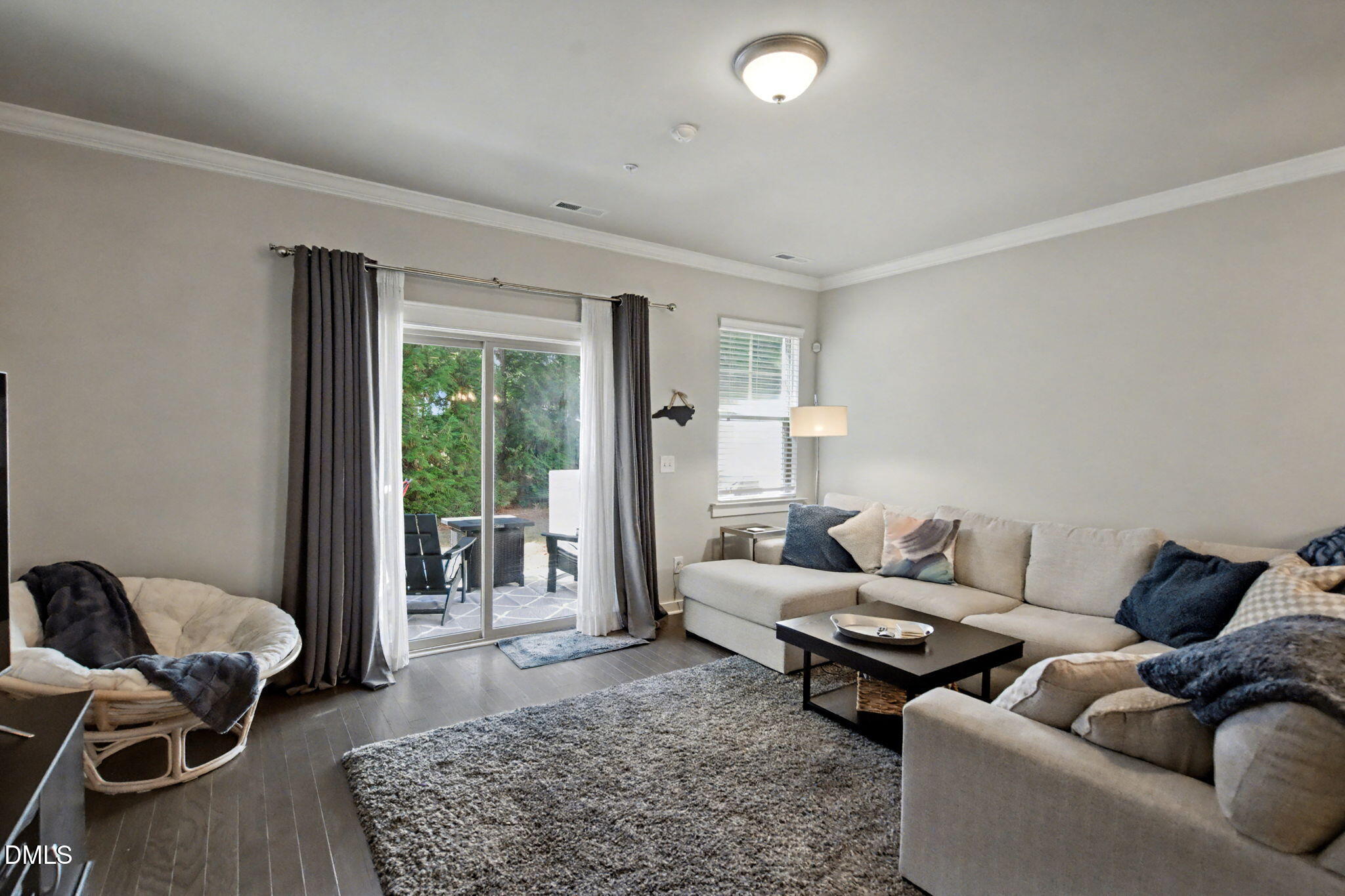 6321 Pesta Court Raleigh, NC 27612 - Photo 12 of 26 a living room with furniture and a large window