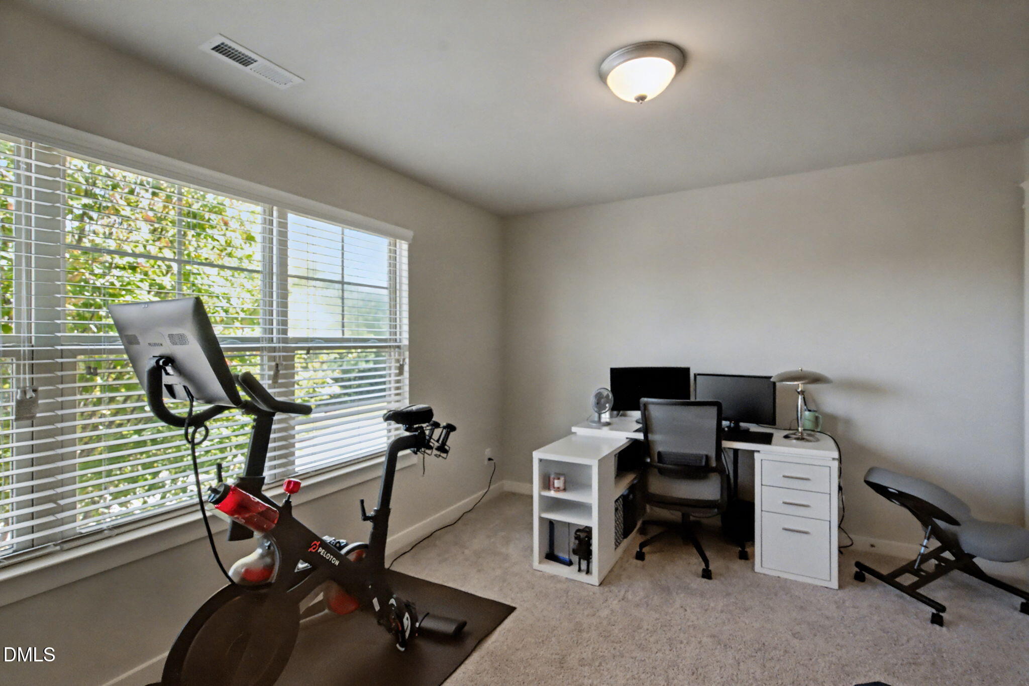 6321 Pesta Court Raleigh, NC 27612 - Photo 20 of 26 a view of a workspace with furniture and a window