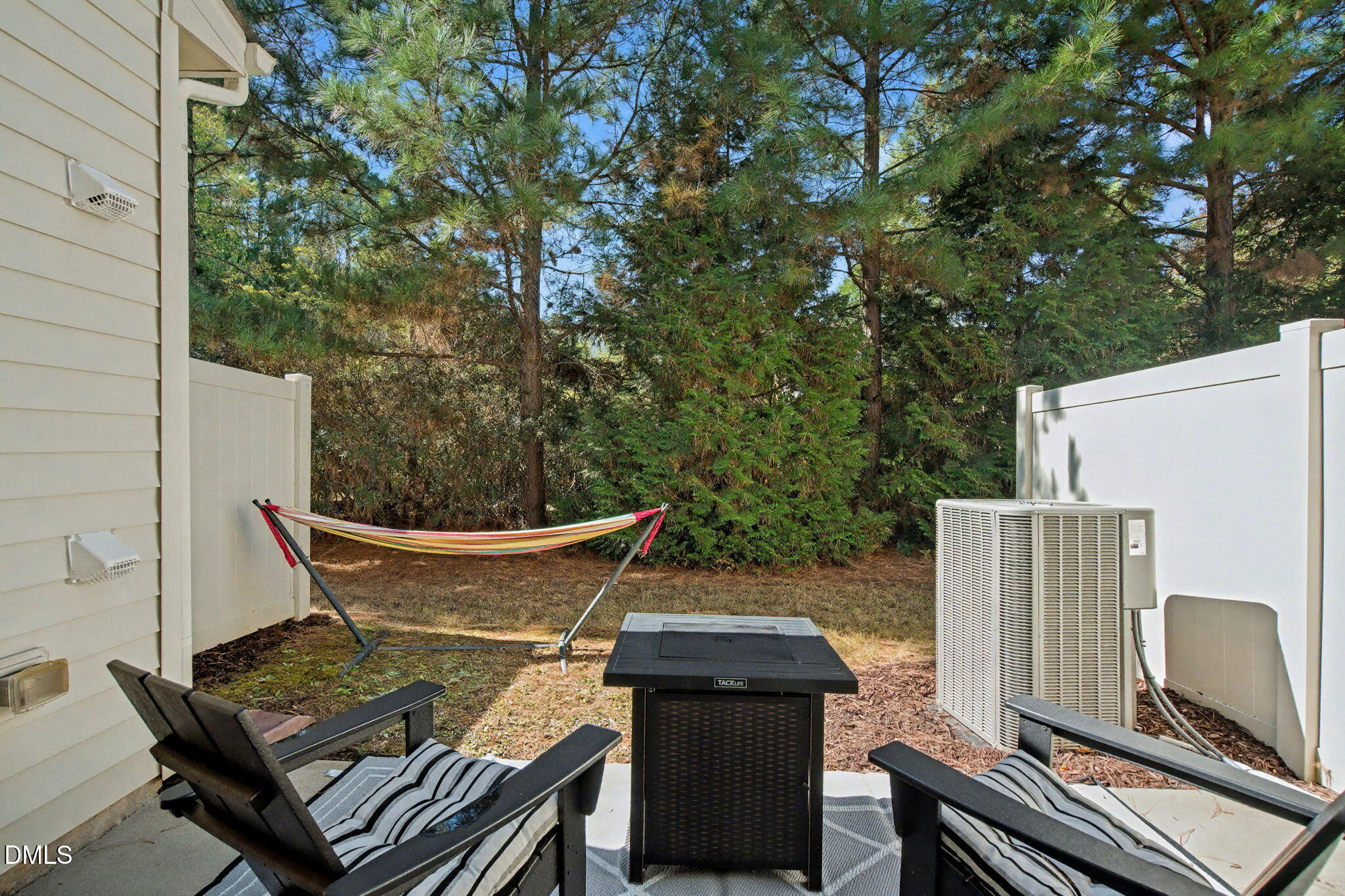 6321 Pesta Court Raleigh, NC 27612 - Photo 24 of 26 a view of a chairs and table in the backyard
