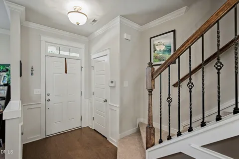 a kitchen with stainless steel appliances granite countertop a refrigerator a stove a sink and a microwave