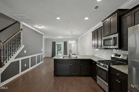 an empty room with wooden floor and a window