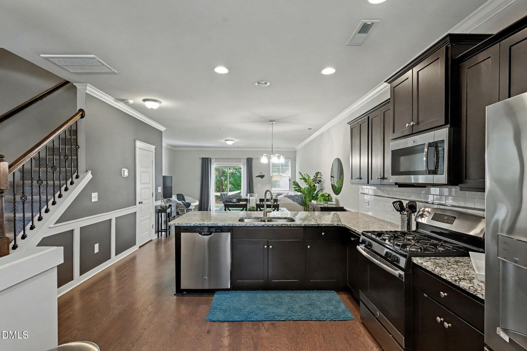 6321 Pesta Court Raleigh, NC 27612 - Photo 6 of 26 a kitchen with lots of counter top space sink and stainless steel appliances