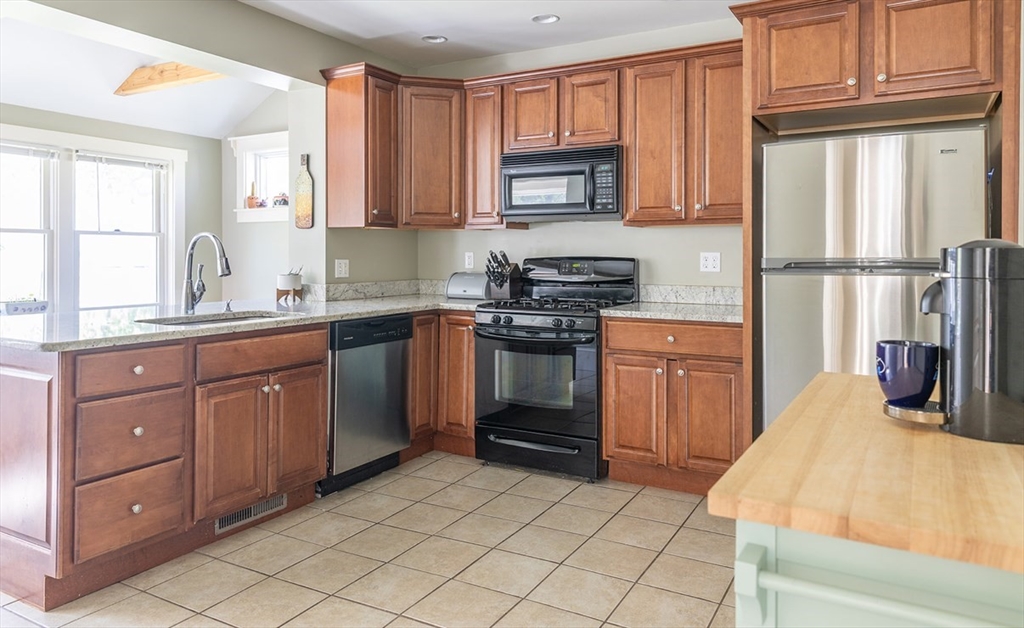 103 Maple Road Longmeadow, MA 01106 - Photo 24 of 35 a kitchen with a sink stove and cabinets