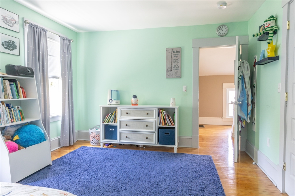 103 Maple Road Longmeadow, MA 01106 - Photo 29 of 35 a view of a bedroom with baby crib and cabinet