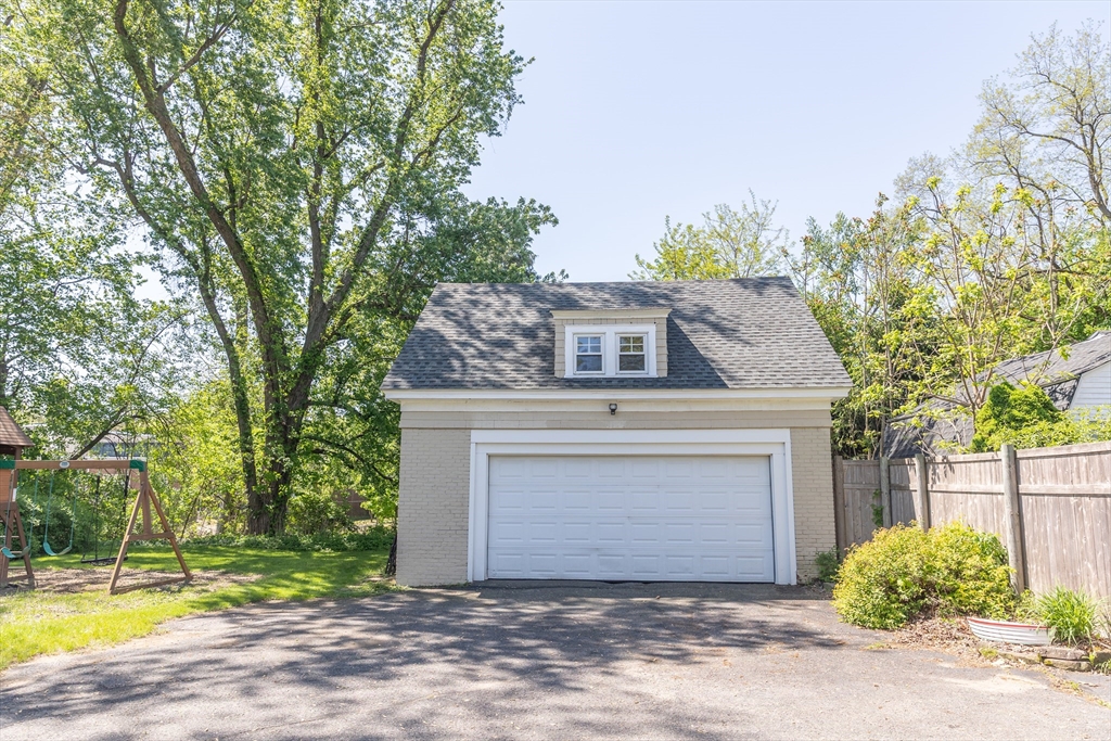 103 Maple Road Longmeadow, MA 01106 - Photo 3 of 35 a front view of a house with a yard and garage