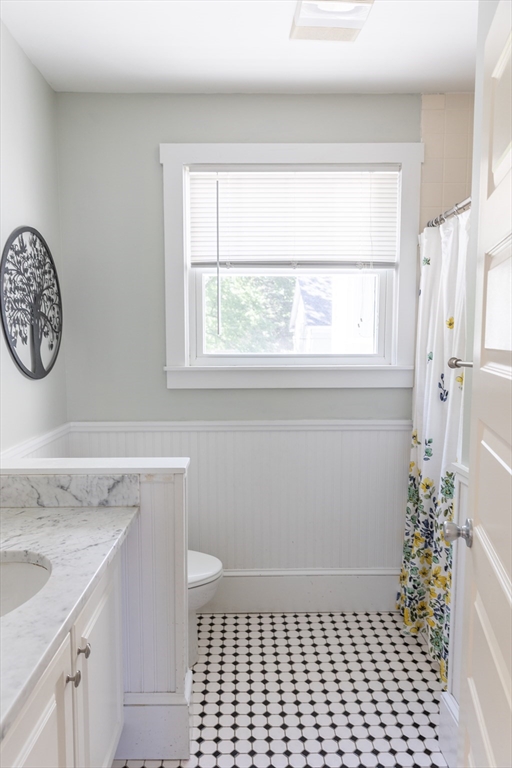 103 Maple Road Longmeadow, MA 01106 - Photo 32 of 35 a bathroom with a granite countertop sink and a toilet