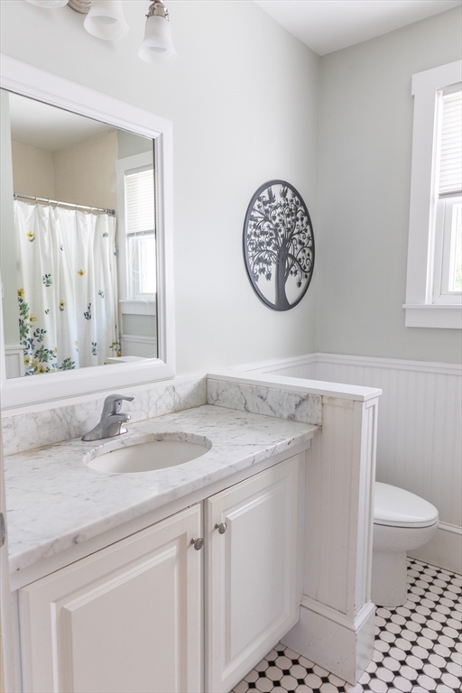 103 Maple Road Longmeadow, MA 01106 - Photo 33 of 35 a bathroom with a sink a toilet and a mirror