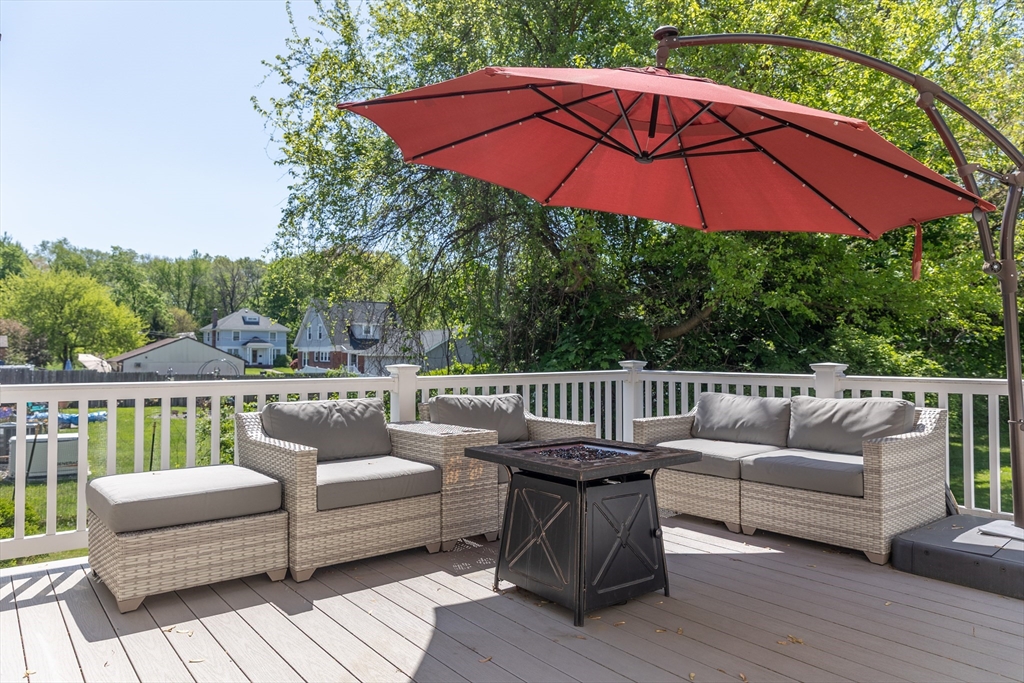 103 Maple Road Longmeadow, MA 01106 - Photo 9 of 35 a balcony with furniture and wooden floor