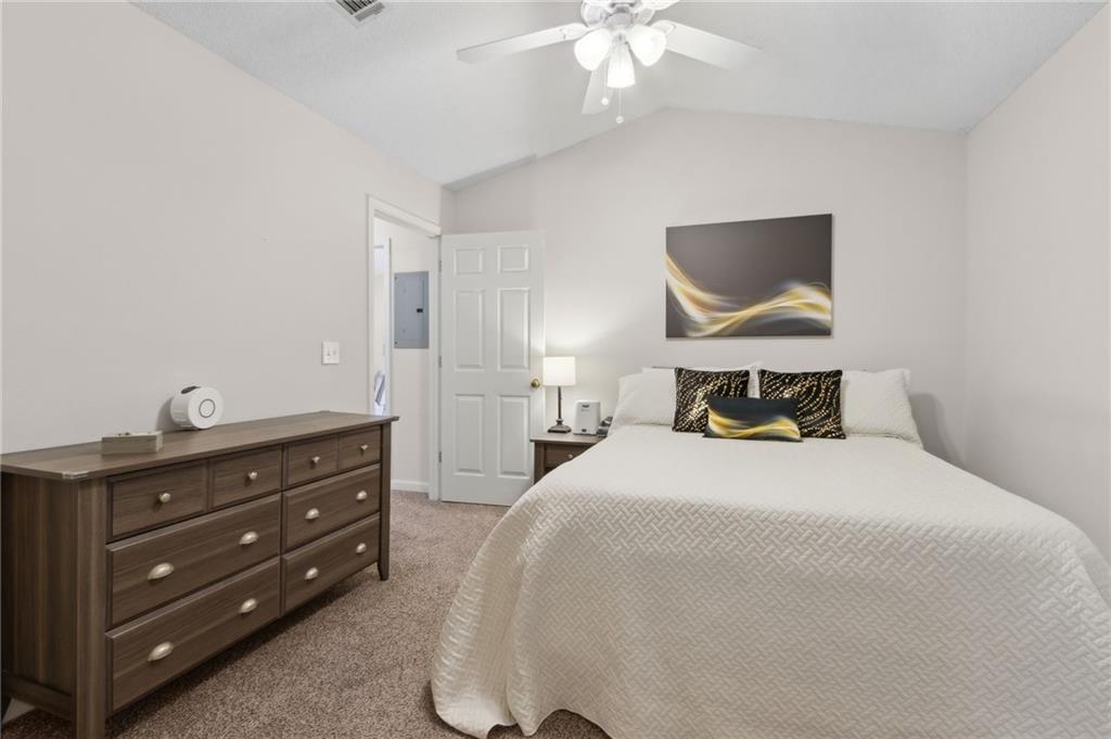 2905 Florence Drive Gainesville, GA 30504 - Photo 22 of 32 a bedroom with a bed and a chandelier