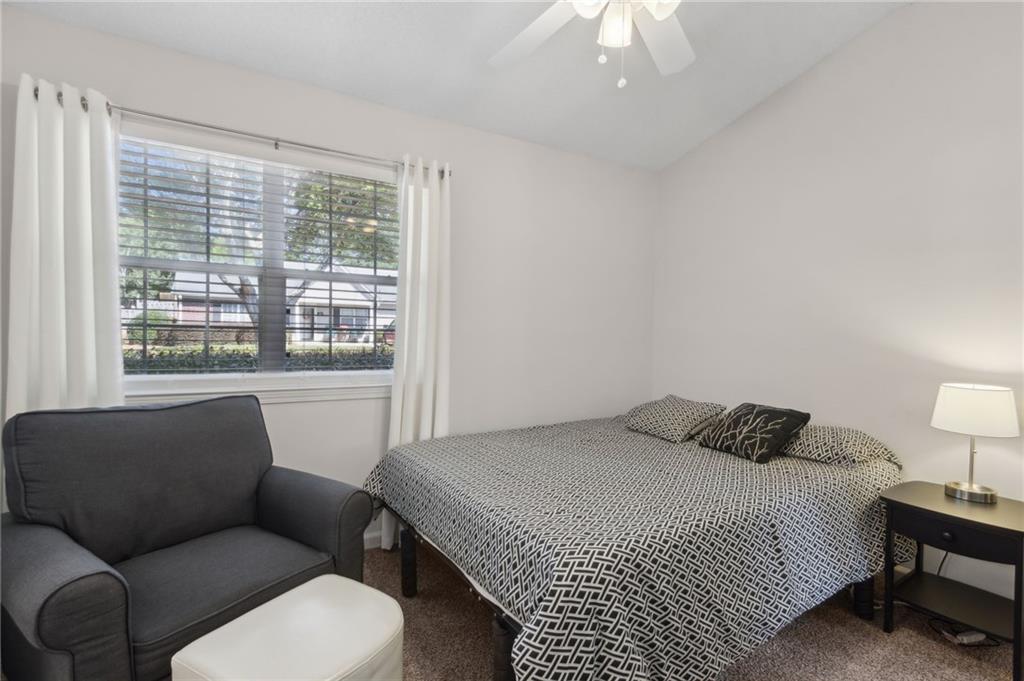 2905 Florence Drive Gainesville, GA 30504 - Photo 25 of 32 a bedroom with a bed couch and window