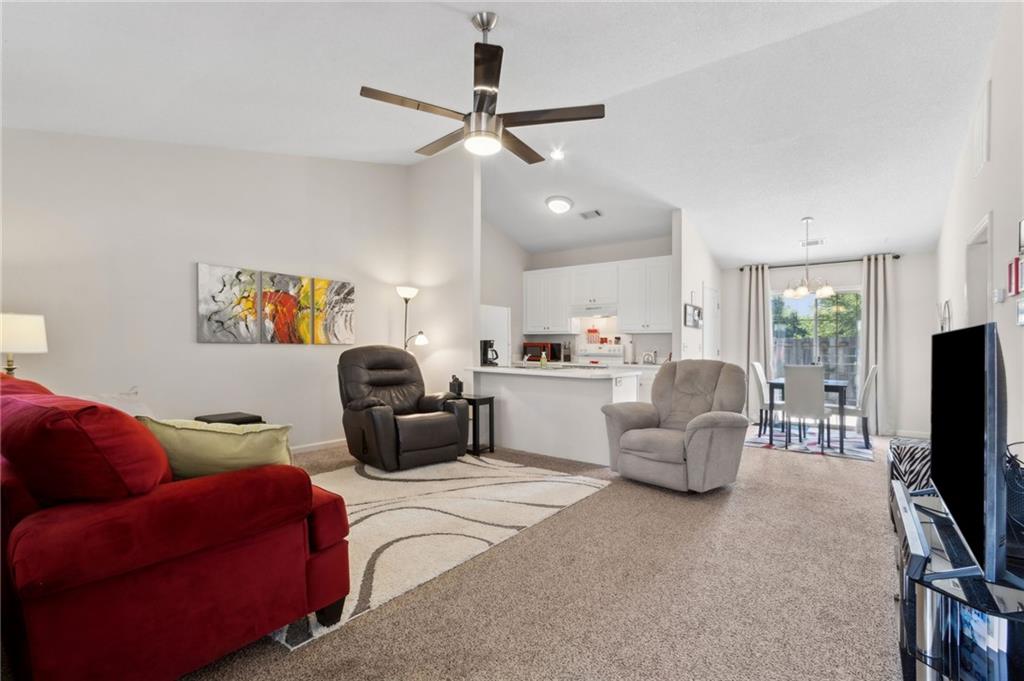 2905 Florence Drive Gainesville, GA 30504 - Photo 5 of 32 a living room with furniture and a flat screen tv