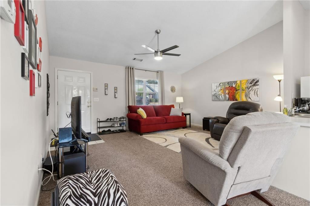 2905 Florence Drive Gainesville, GA 30504 - Photo 9 of 32 a living room with furniture and a ceiling fan