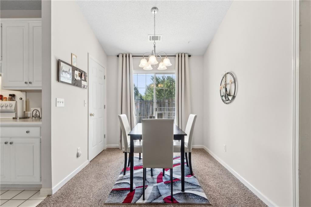 2905 Florence Drive Gainesville, GA 30504 - Photo 10 of 32 a view of a dining room with furniture window and outside view