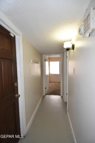 a view of an empty room with windows