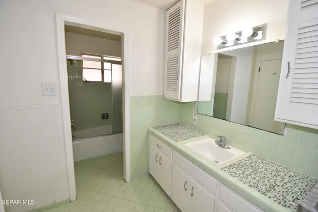 a view of an empty room with windows