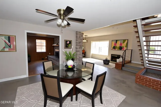 a dining room with furniture and window