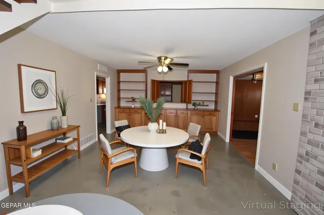 a view of an empty room with windows