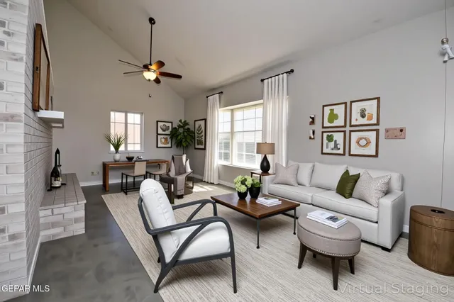 a living room with furniture and a fireplace