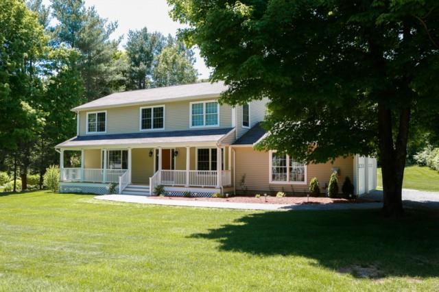 75 Teller Road Trumbull, CT 06611 - Photo 1 of 1 a front view of a house with a yard table and chairs